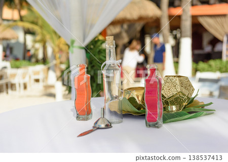 Sand ceremony bottles on white table outdoor Sand ceremony bottles on white table outdoor 138537413