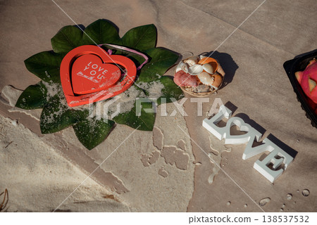 Beach love decoration with heart box and seashells Beach love decoration with heart box and seashells 138537532