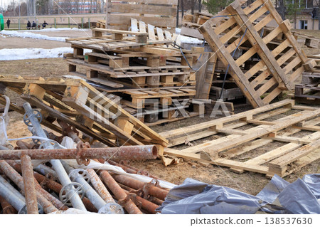 Old wooden pallets at a construction site. Used wooden pallets Old wooden pallets at a construction site. Used wooden pallets 138537630