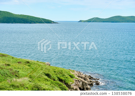 The nature of the Khasansky district of Primorsky Krai, Russia. The lip of the Teal of the Slavic Bay, the inner bay of Peter the Great in the summer. The nature of the Khasansky district of Primorsky Krai, Russia. The lip of the Teal of the Slavic Bay, the inner bay of Peter the Great in the summer. 138538076