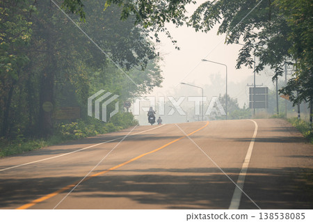 Northern Thailand suffering from dry season and heavy mountain fires, smog and smoke covering roads. Northern Thailand suffering from dry season and heavy mountain fires, smog and smoke covering roads. 138538085