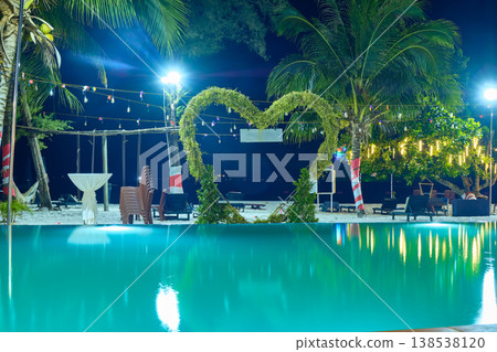 swimming pool on the beach against the background of the sea of one of the hotels at night on the Long beach of Koh Rong Island, Cambodia swimming pool on the beach against the background of the sea of one of the hotels at night on the Long beach of Koh Rong Island, Cambodia 138538120