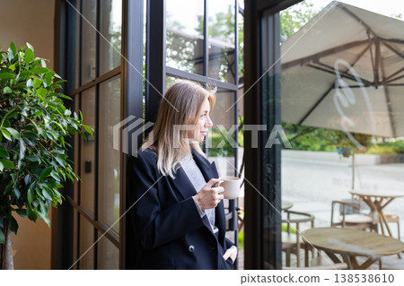 Thoughtful businesswoman restaurant director enjoying coffee and thinking planning new career goals. 138538610
