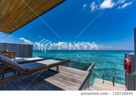 Terrace of an overwater villa with a pool in the Maldives Terrace of an overwater villa with a pool in the Maldives 138538844