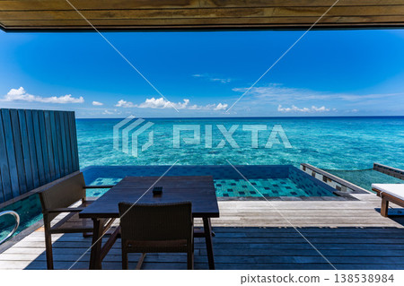 Terrace of an overwater villa with a pool in the Maldives Terrace of an overwater villa with a pool in the Maldives 138538984