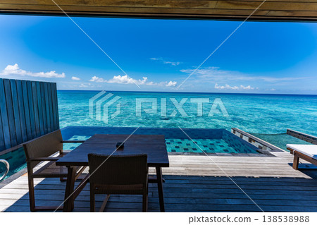 Terrace of an overwater villa with a pool in the Maldives Terrace of an overwater villa with a pool in the Maldives 138538988