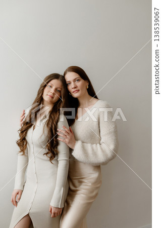 Portrait Of Mother And Teenage Girl With Confident Expressions And Coordinated Clothing Portrait Of Mother And Teenage Girl With Confident Expressions And Coordinated Clothing 138539067