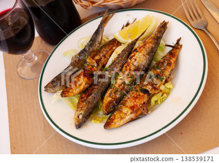 Fried sardines served with slice of lemon 138539171