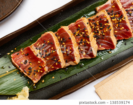 Popular Japanese dish Tataki from tuna with an appetizing ponzu sauce 138539174
