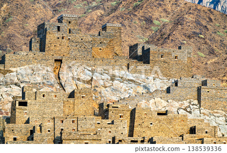Traditional multi-story stone houses of Thee Ain Heritage Village built on a marble hill in the Al Bahah region of Saudi Arabia. 138539336