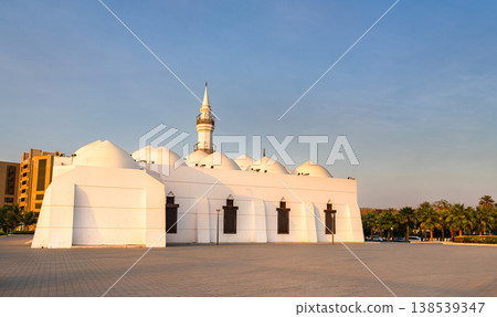 The white architectural facade and domes of the Jaffali Mosque located near Al-Balad in Jeddah, Saudi Arabia at sunset. The white architectural facade and domes of the Jaffali Mosque located near Al-Balad in Jeddah, Saudi Arabia at sunset. 138539347