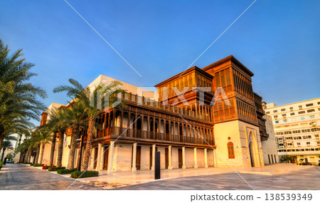 Beautiful restoration of traditional wooden balconies and stonework at Culture Square of Jeddah under a clear blue sky in Saudi Arabia. Beautiful restoration of traditional wooden balconies and stonework at Culture Square of Jeddah under a clear blue sky in Saudi Arabia. 138539349