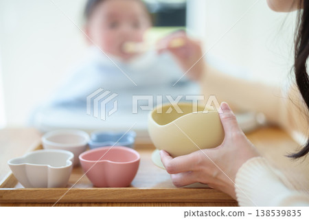 Baby eating baby food Baby eating baby food 138539835