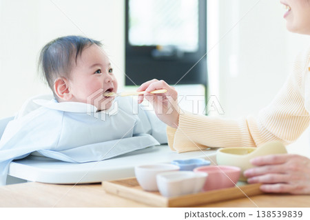 Baby eating baby food 138539839