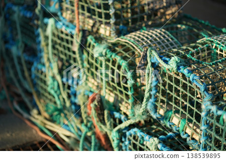 Crab Traps Stacked on a Fishing Boat at Sunrise by Crab Traps Stacked on a Fishing Boat at Sunrise by 138539895