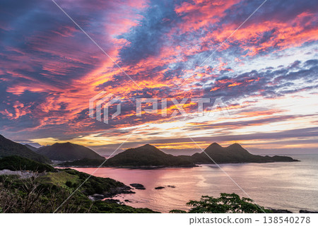 The sacred sunset over Yakushima: Mt. Yahazu and twilight (Summer) The sacred sunset over Yakushima: Mt. Yahazu and twilight (Summer) 138540278