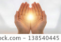 Hands embracing light; spiritual; healing; white background; sacred light 138540445