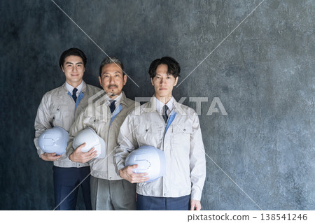 A group of male workers from a wide range of age groups A group of male workers from a wide range of age groups 138541246