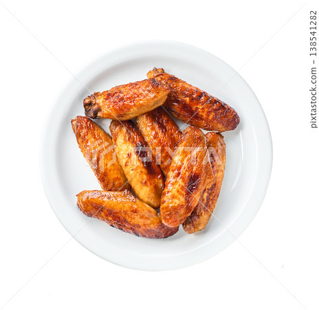bbq chicken wings in a plate isolated on a white background, top view. bbq chicken wings in a plate isolated on a white background, top view. 138541282
