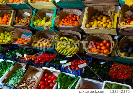 Market counter with fruits and vegetables 138542373