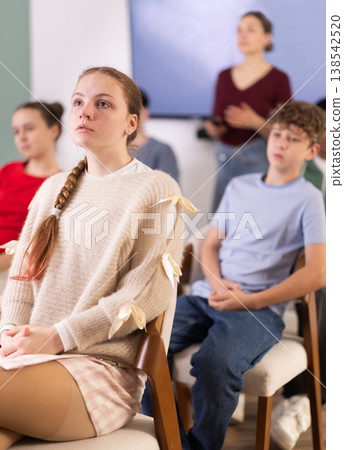 European teenage girl is sitting in a school classroom 138542520