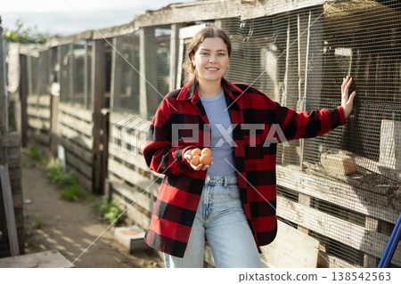 Young woman with chicken eggs in hen house Young woman with chicken eggs in hen house 138542563