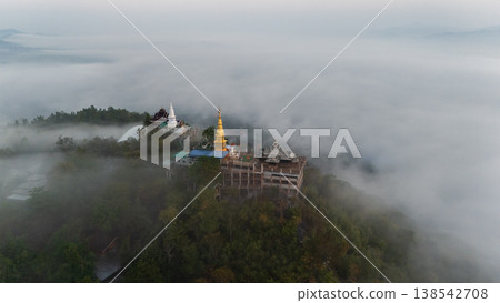 Aerial view of Wat Phra Phutthabat Pha Nam temple in Li district, Lamphun province of Thailand during morning. Aerial view of Wat Phra Phutthabat Pha Nam temple in Li district, Lamphun province of Thailand during morning. 138542708