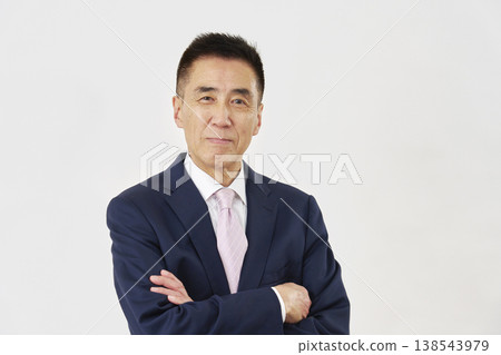 Smiling businessman on white background Smiling businessman on white background 138543979