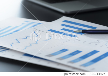 Business reports and financial data analysis. Documents containing graphs and charts for business planning and decision-making. Business reports and financial data analysis. Documents containing graphs and charts for business planning and decision-making. 138544474
