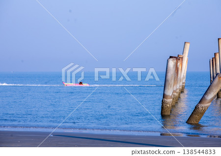 The Leaning pole at Sao Aiang Beach with banana boat The Leaning pole at Sao Aiang Beach with banana boat 138544833