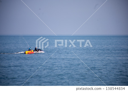 The banana boat with people playing on the boat 138544834