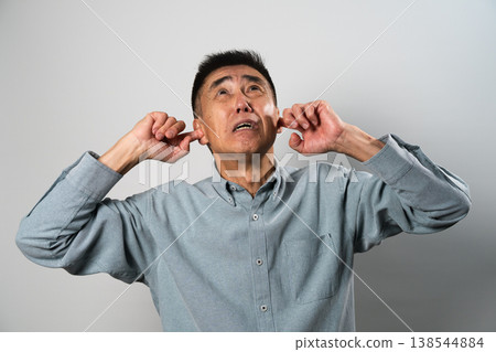 A senior man in casual clothes standing – a lifestyle image. 138544884