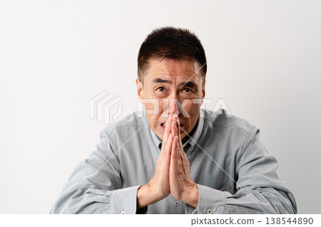 A senior man in casual clothes standing – a lifestyle image. A senior man in casual clothes standing – a lifestyle image. 138544890