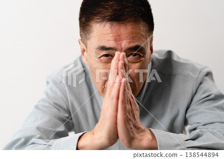A senior man in casual clothes standing – a lifestyle image. A senior man in casual clothes standing – a lifestyle image. 138544894