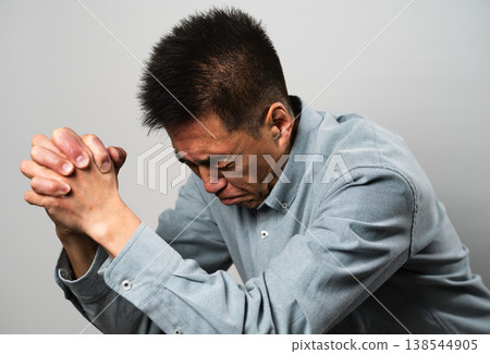 A senior man in casual clothes standing – a lifestyle image. A senior man in casual clothes standing – a lifestyle image. 138544905