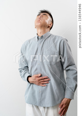 A senior man in casual clothes standing – a lifestyle image. A senior man in casual clothes standing – a lifestyle image. 138544946