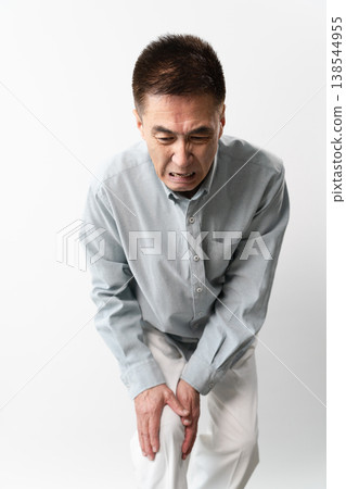 A senior man in casual clothes standing – a lifestyle image. A senior man in casual clothes standing – a lifestyle image. 138544955