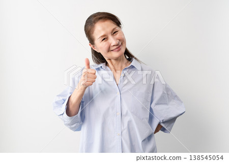 A senior woman in casual clothes standing – a lifestyle image. 138545054