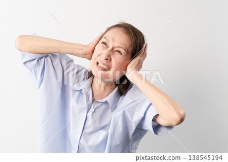 A senior woman in casual clothes standing – a lifestyle image. 138545194