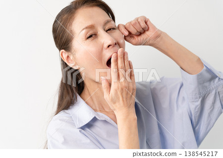 A senior woman in casual clothes standing – a lifestyle image. 138545217