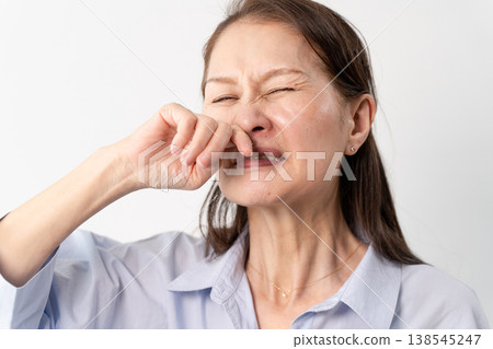 A senior woman in casual clothes standing – a lifestyle image. A senior woman in casual clothes standing – a lifestyle image. 138545247