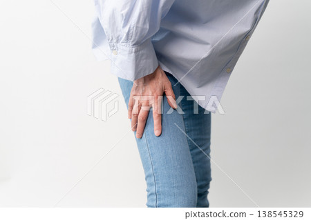 A senior woman in casual clothes standing – a lifestyle image. A senior woman in casual clothes standing – a lifestyle image. 138545329