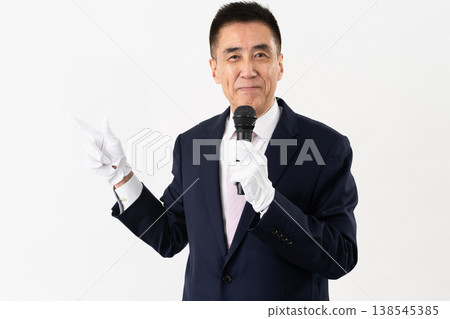Senior man giving a campaign speech while holding a microphone Senior man giving a campaign speech while holding a microphone 138545385
