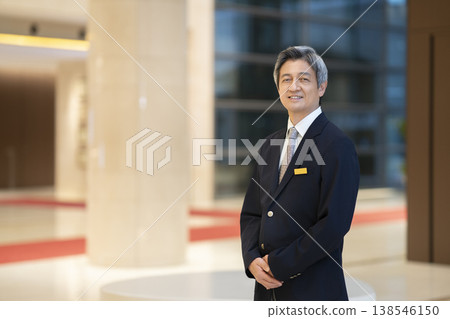 Portrait of a senior businessman smiling and looking directly at the camera. Portrait of a senior businessman smiling and looking directly at the camera. 138546150