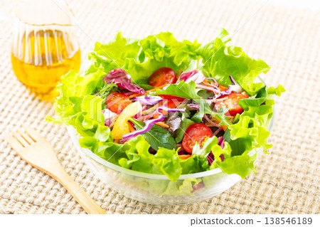 Vegetable salad and olive oil on the table Vegetable salad and olive oil on the table 138546189