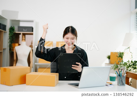 Small business entrepreneur SME freelance woman working at home office, BOX,tablet and laptop online, marketing, packaging, delivery, e-commerce concept Small business entrepreneur SME freelance woman working at home office, BOX,tablet and laptop online, marketing, packaging, delivery, e-commerce concept 138546292