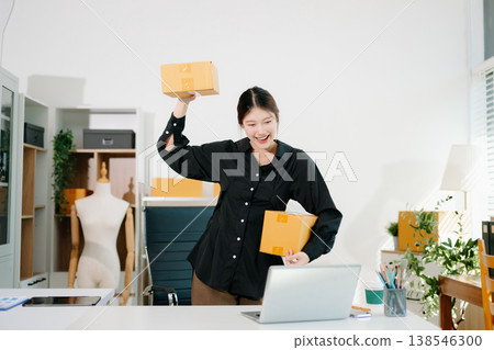 Small business entrepreneur SME freelance woman working at home office, BOX,tablet and laptop online, marketing, packaging, delivery, e-commerce concept Small business entrepreneur SME freelance woman working at home office, BOX,tablet and laptop online, marketing, packaging, delivery, e-commerce concept 138546300