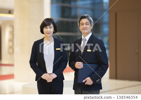 Senior business professionals (male and female) - Front desk staff image Senior business professionals (male and female) - Front desk staff image 138546354