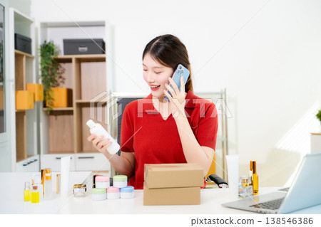 Young business owner woman prepare parcel box and standing check online orders for deliver to customer on tablet, laptop Shopping Online concept. Young business owner woman prepare parcel box and standing check online orders for deliver to customer on tablet, laptop Shopping Online concept. 138546386
