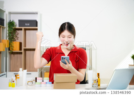 Startup small business SME, Entrepreneur owner woman using smartphone or tablet taking receive and checking online purchase shopping order Startup small business SME, Entrepreneur owner woman using smartphone or tablet taking receive and checking online purchase shopping order 138546390